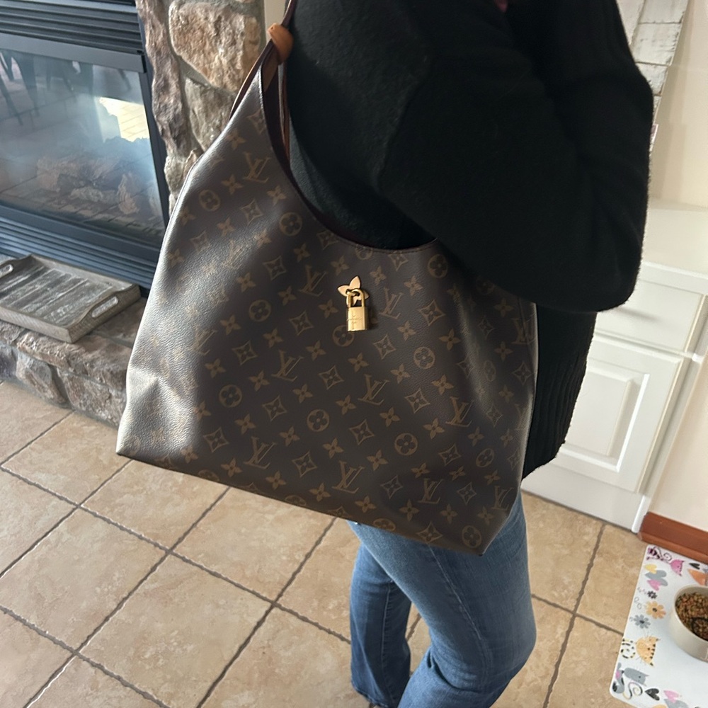 Louis Vuitton flower hobo bag. With box and bag. Receipt shown for reference.